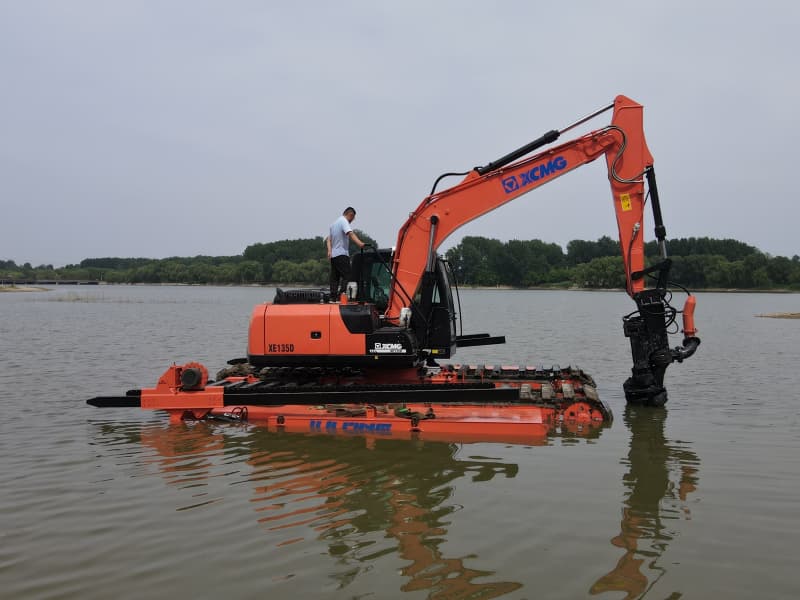 Pontoons Equipped Amphibious Excavator Working in Lake River